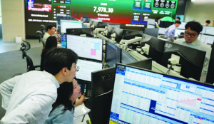 World shares mostly gain as investors watch Trump-Xi summit