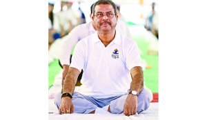 Yoga offers solutions to global health challenges: Pradhan at DU event