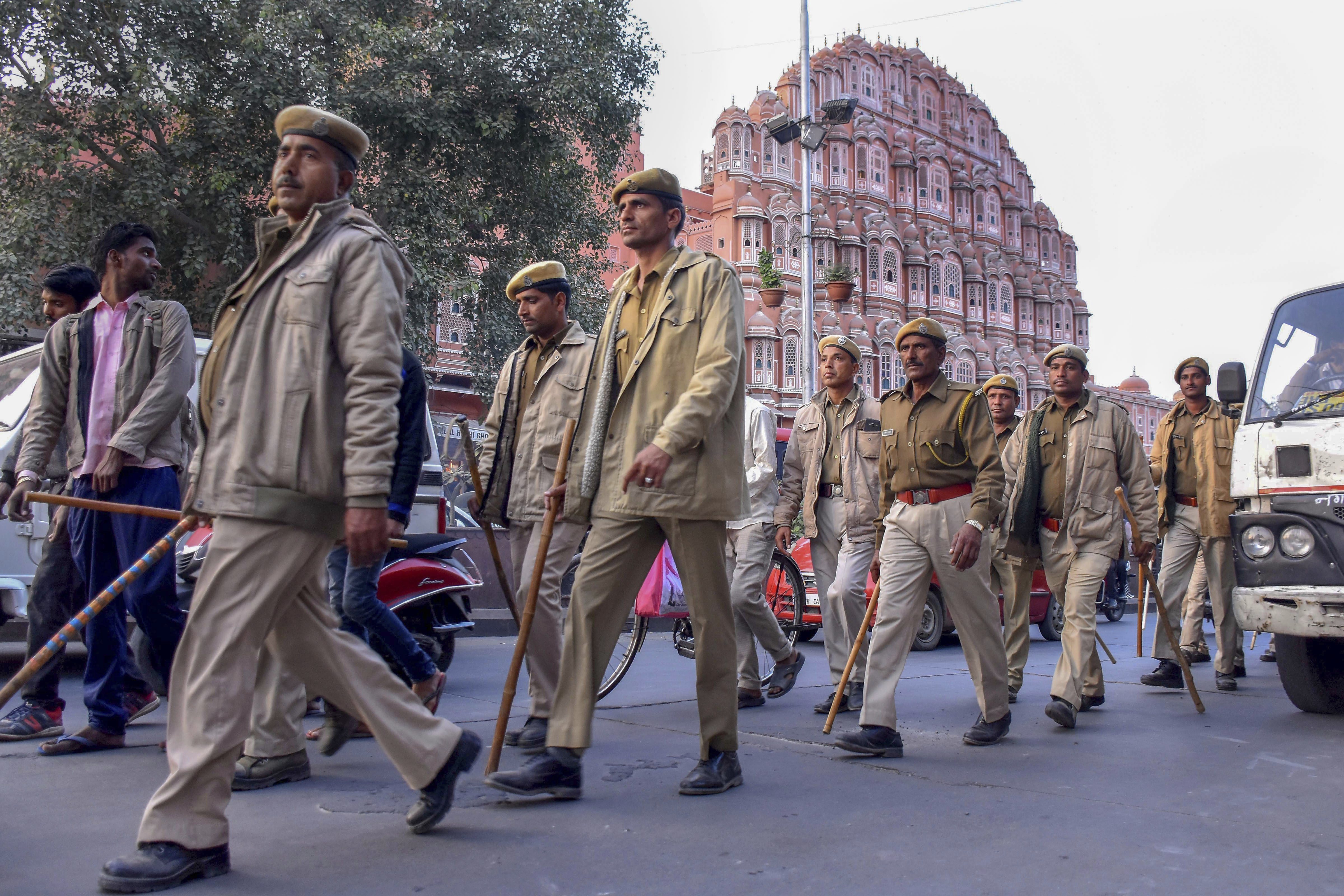 Police personnel conduct a march in front of Hawa Mahal ahead of Rajasthan Assembly elections, in Jaipur - PTI