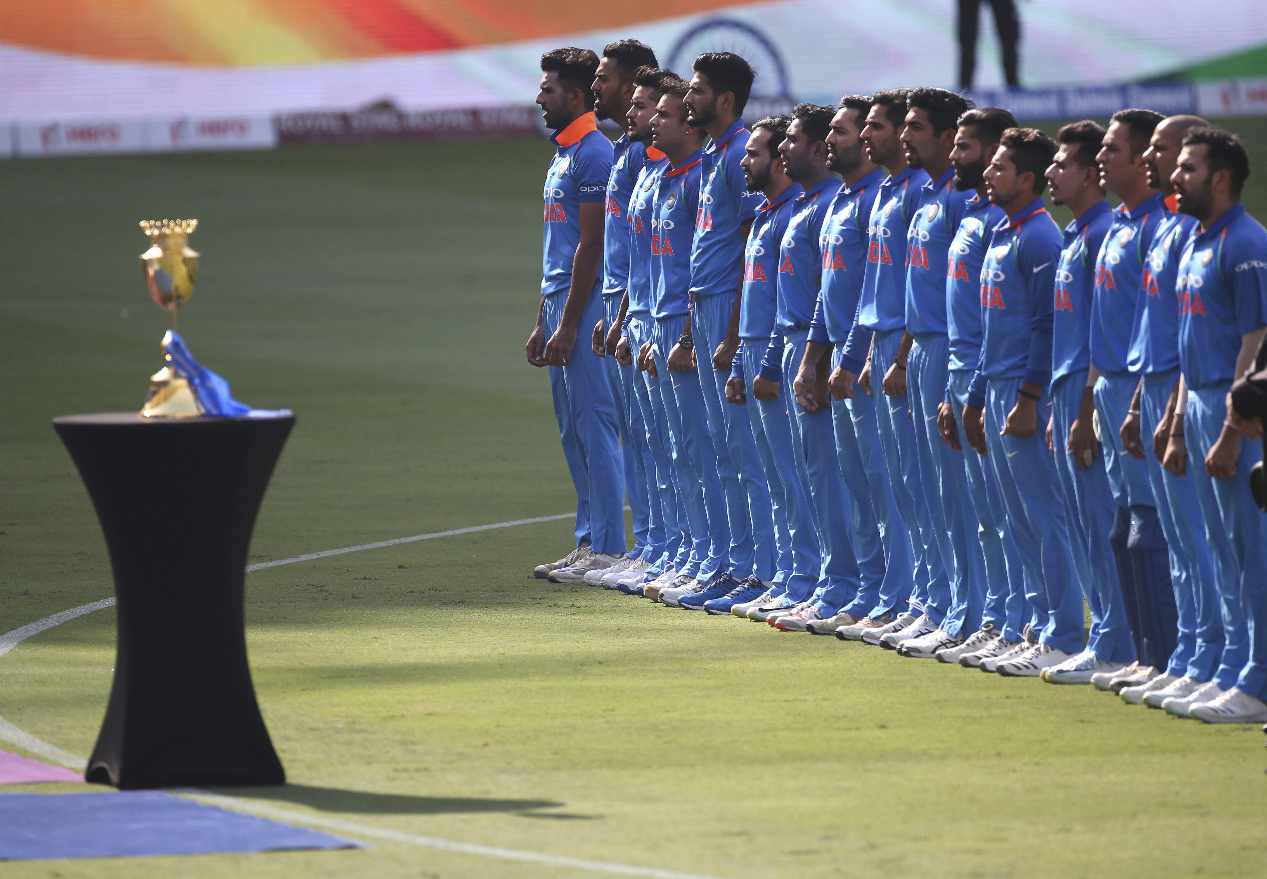 Members of the Indian team stand for their national anthem before the start of the final one day international cricket match of Asia Cup between India and Bangladesh, in Dubai, United Arab Emirates - AP