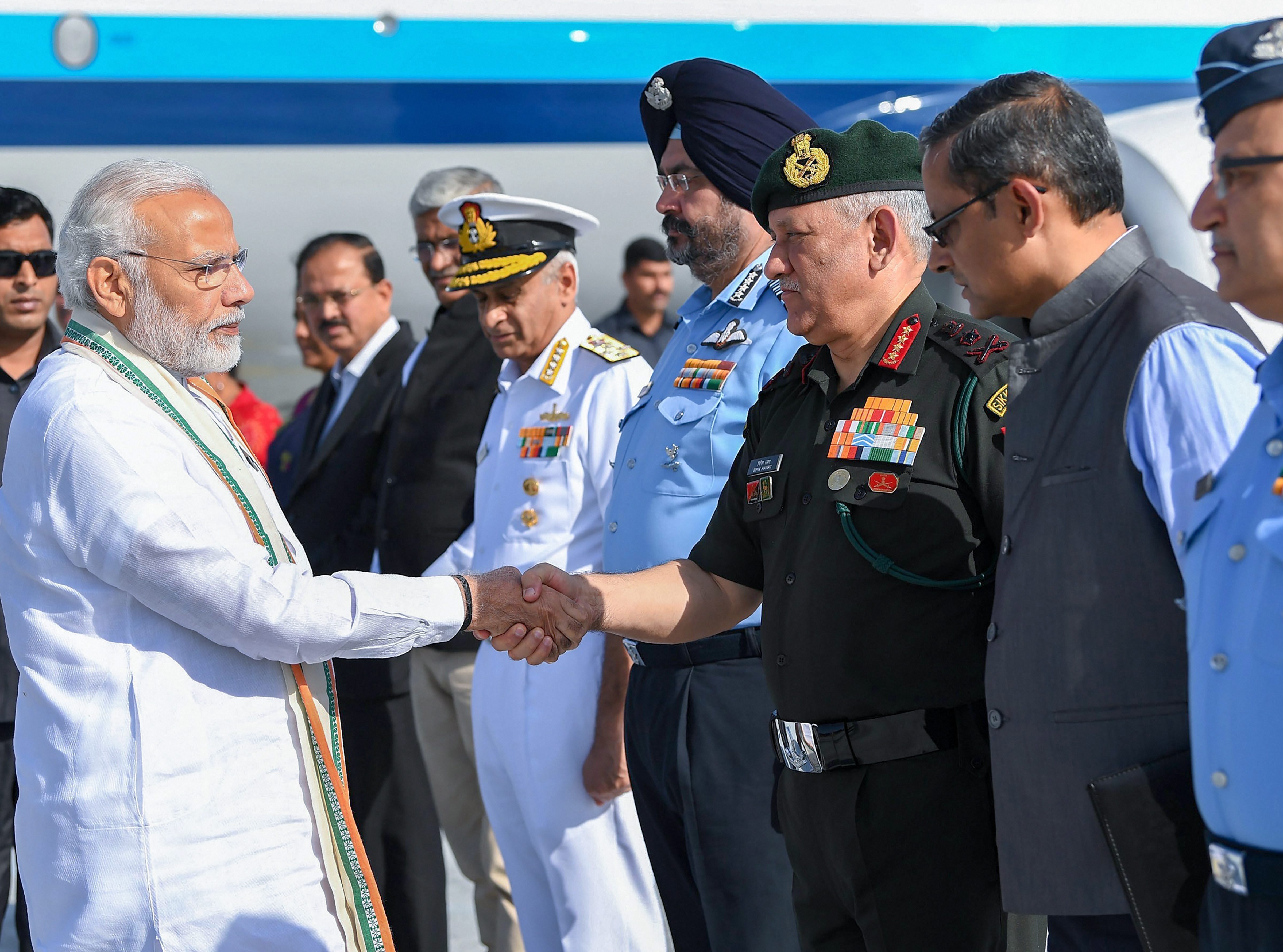 Prime Minister Narendra Modi shakes hands with Army Chief General Bipin Rawat on his arrival to attend 'Parakram Parv' celebrations, in Jodhpur - PTI