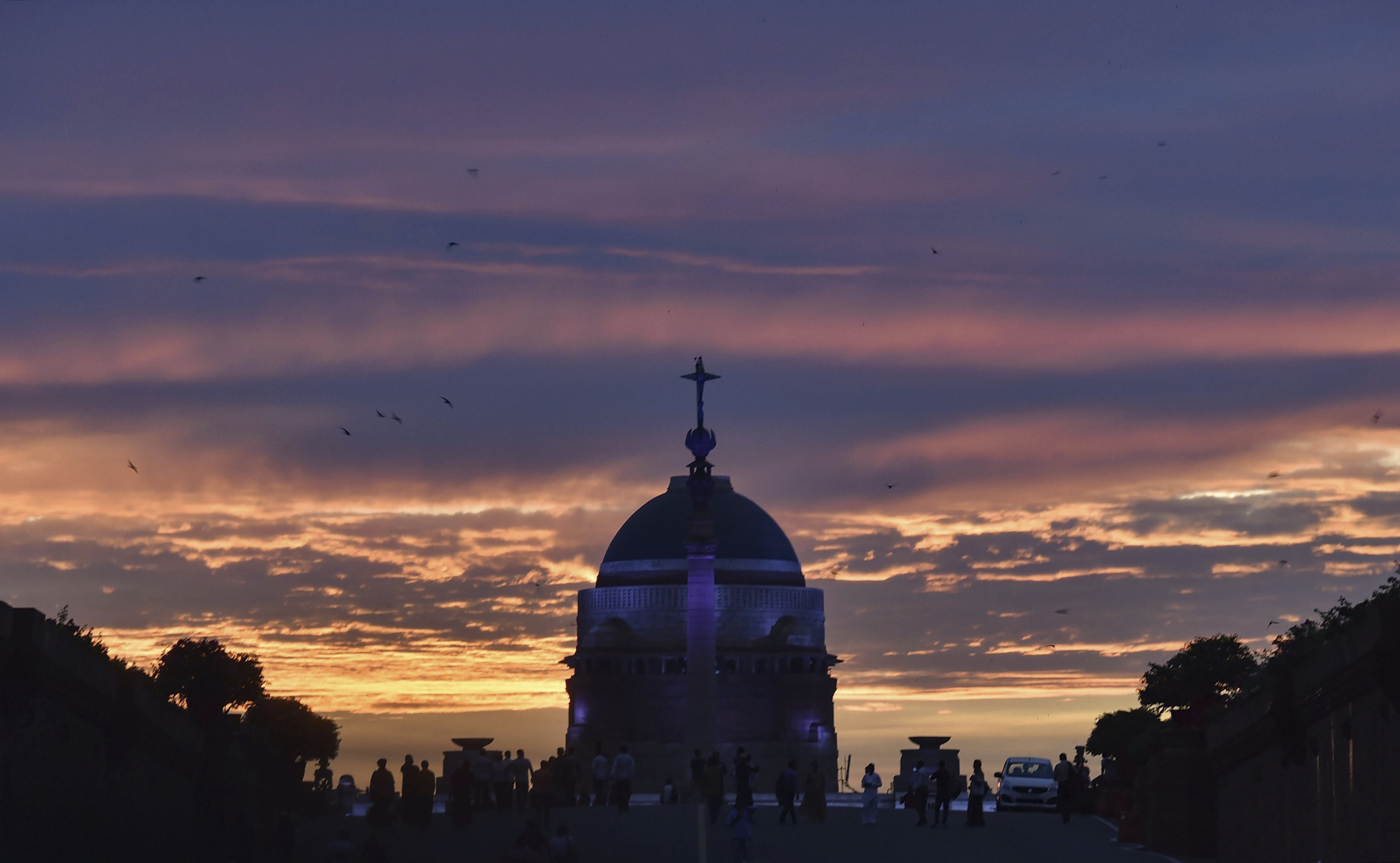 A view of the sunset over Raisina Hills, in New Delhi - PTI