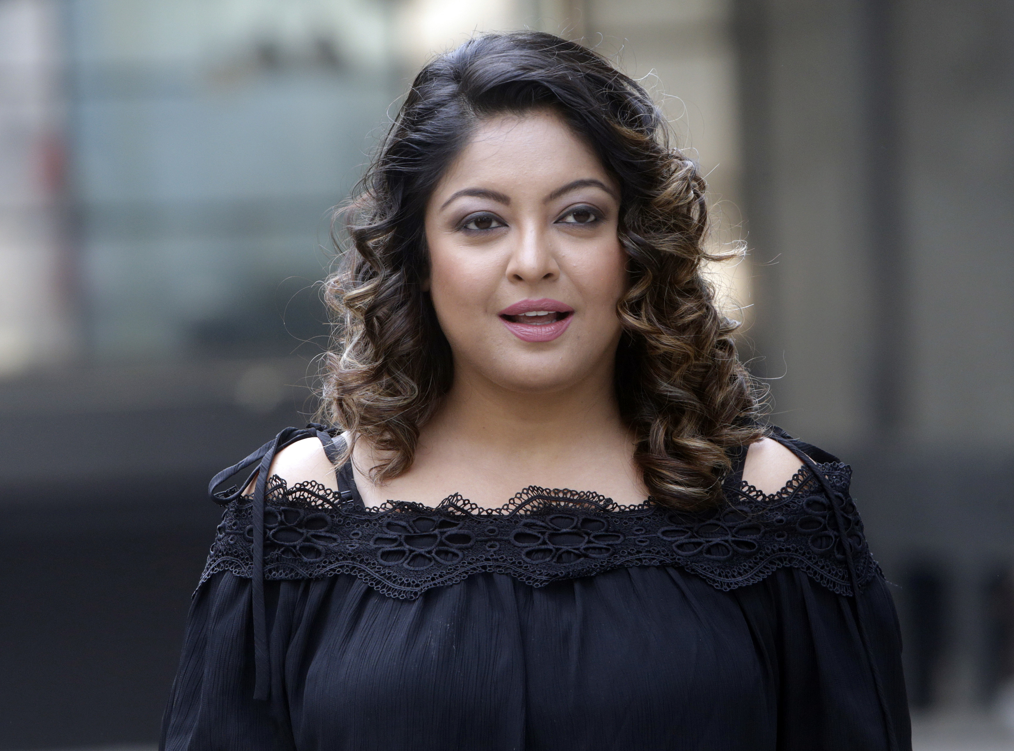 Former Bollywood actress Tanushree Dutta stands for photographs outside a media house in Mumbai - AP