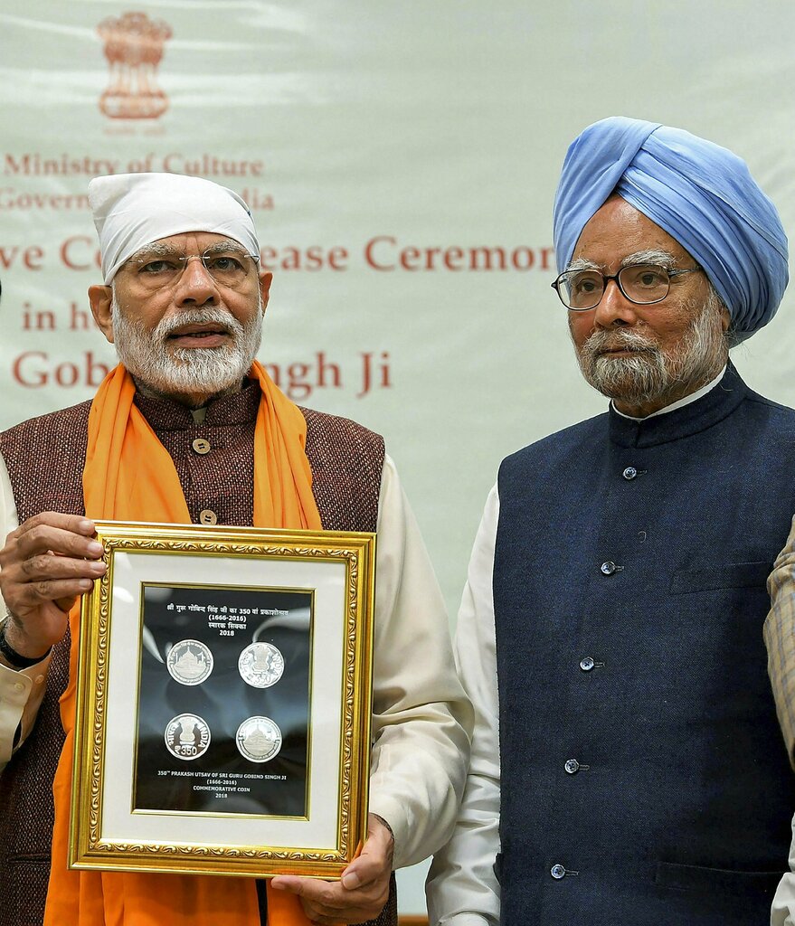 Prime Minister Narendra Modi releases a commemorative coin to mark the birth anniversary of Guru Gobind Singh Ji, the tenth guru of Sikhs, in New Delhi - PTI