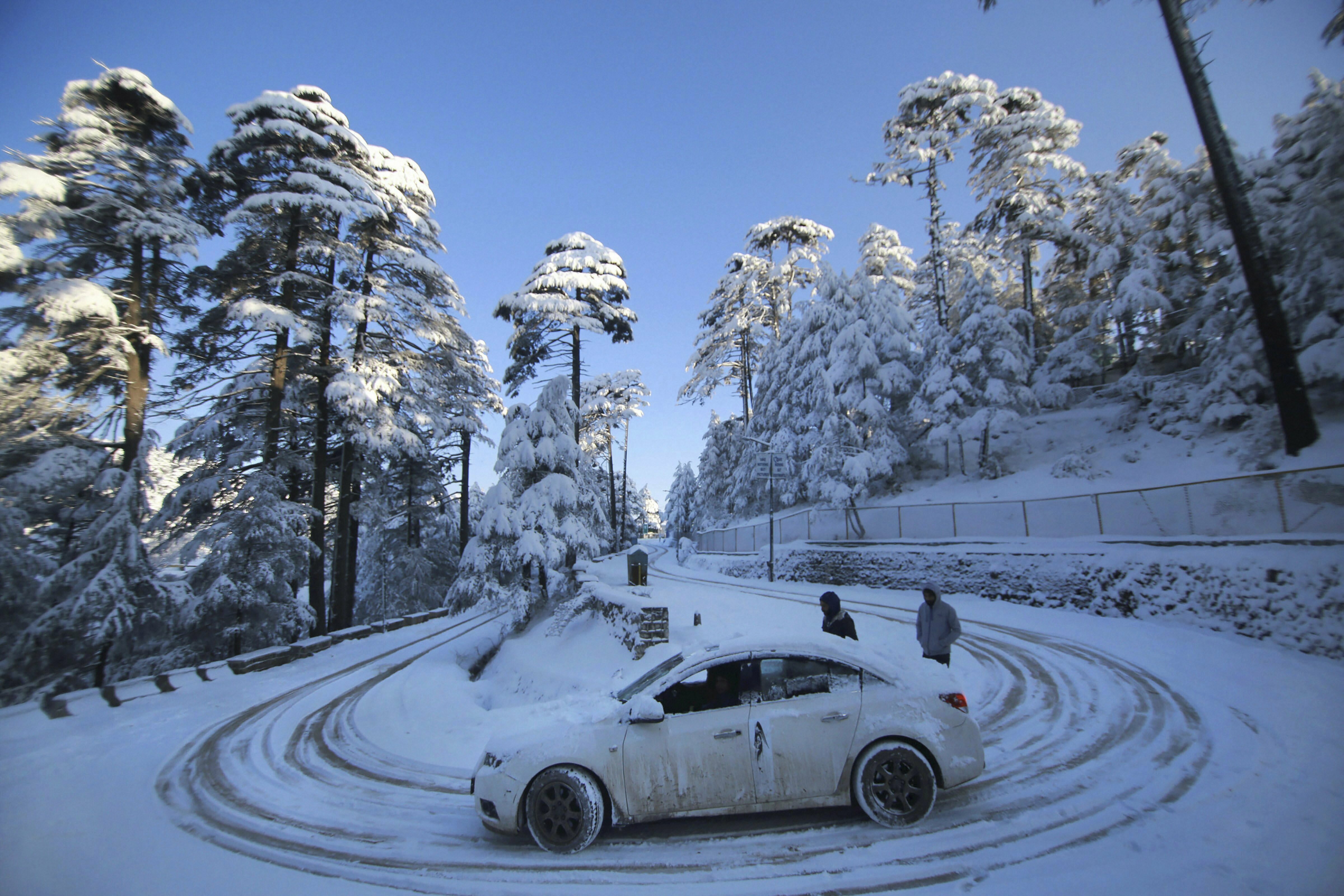 A view of snow-laden roads near the Jammu-Srinagar national highway, at Patnitop, about 115 km from Jammu - PTI