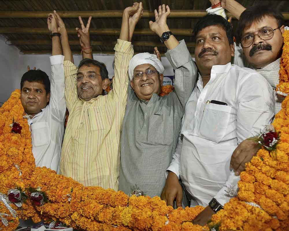 Rashtriya Lok Samta Party (RLSP) chief Upendra Kushwaha with former HAM (S) state president Brishin Patel after the latter joined RLSP, ahead of the Lok Sabha elections - PTI