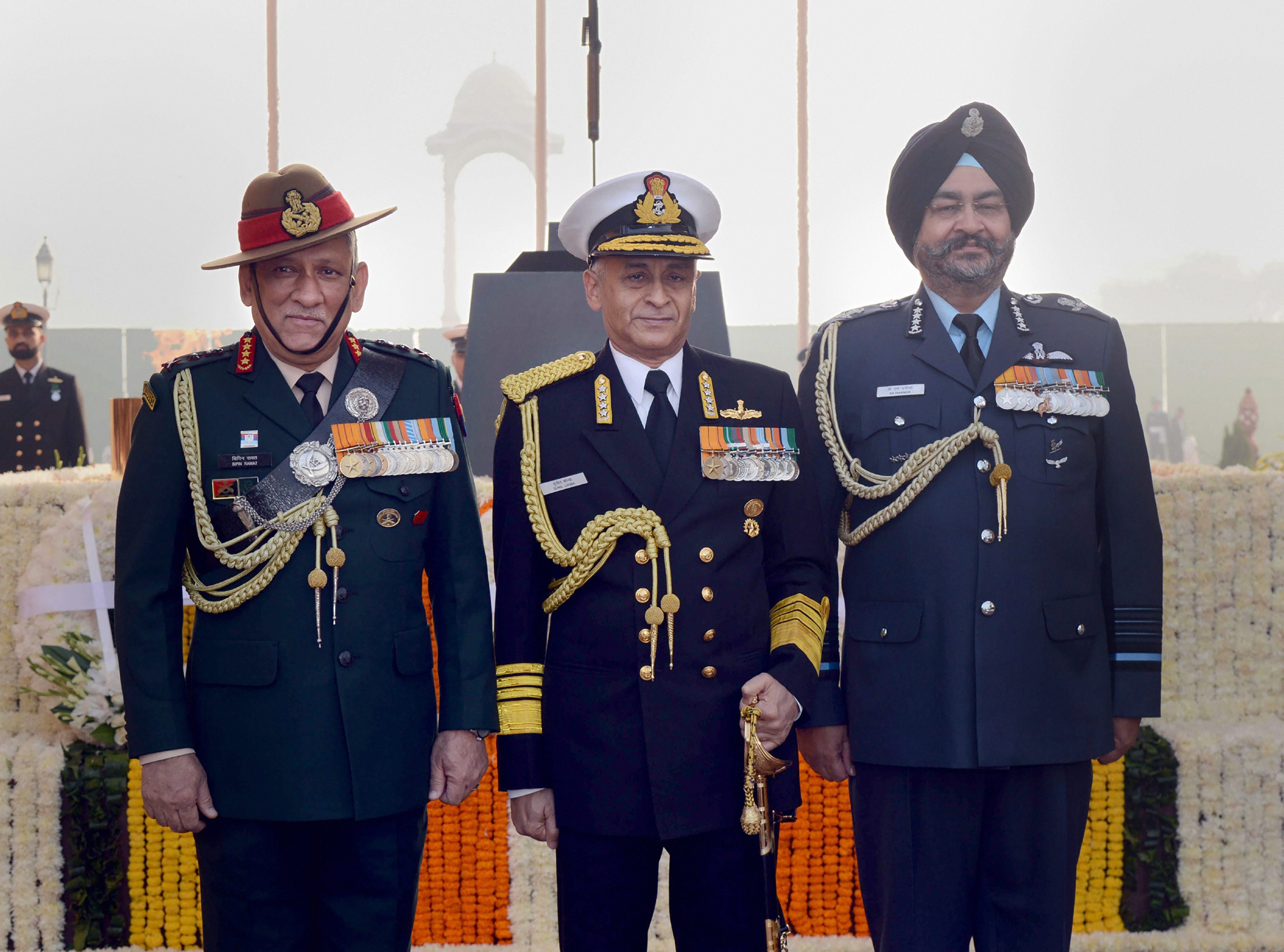 Chief of Army Staff General Bipin Rawat, Chief of Naval Staff Admiral Sunil Lanba and Chief of Air Staff Air Chief Marshal BS Dhanoa on the occasion of Navy Day at Amar Jawan Jyoti, India Gate, in New Delhi - PTI