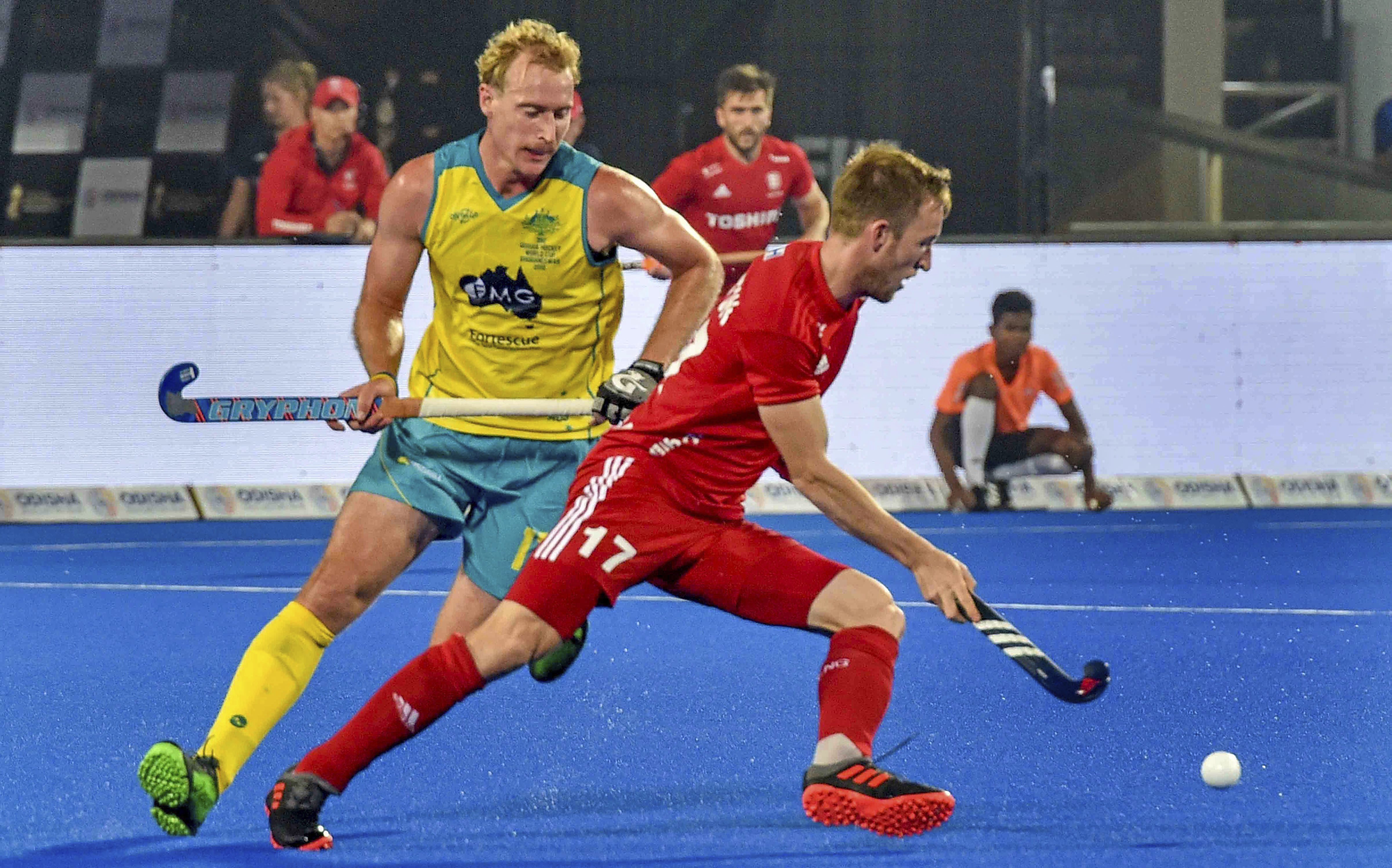 Australia's (yellow) captain Aran Zalewsk in action during a match against England's Barry Middleton, at Men's Hockey World Cup 2018, at Kalinga Stadium in Bhubaneswar - PTI