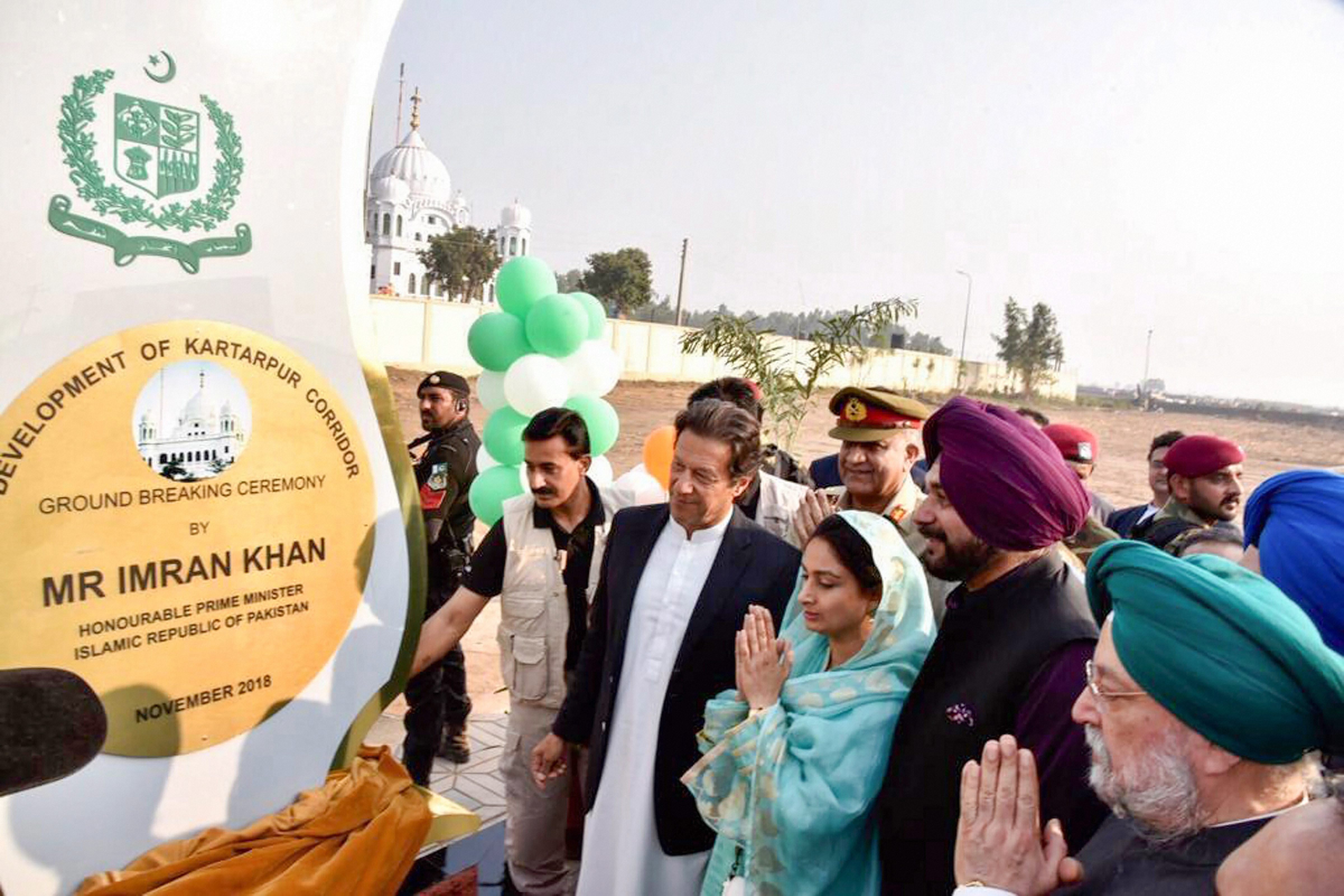 Pakistan's Prime Minister Imran Khan, cricketer-turned-Indian politician Navjot Singh Sidhu, Minister for Food Processing Industries Harsimrat Kaur Badal during ground breaking ceremony for Kartarpur corridor in Pakistan's Kartarpur - PTI