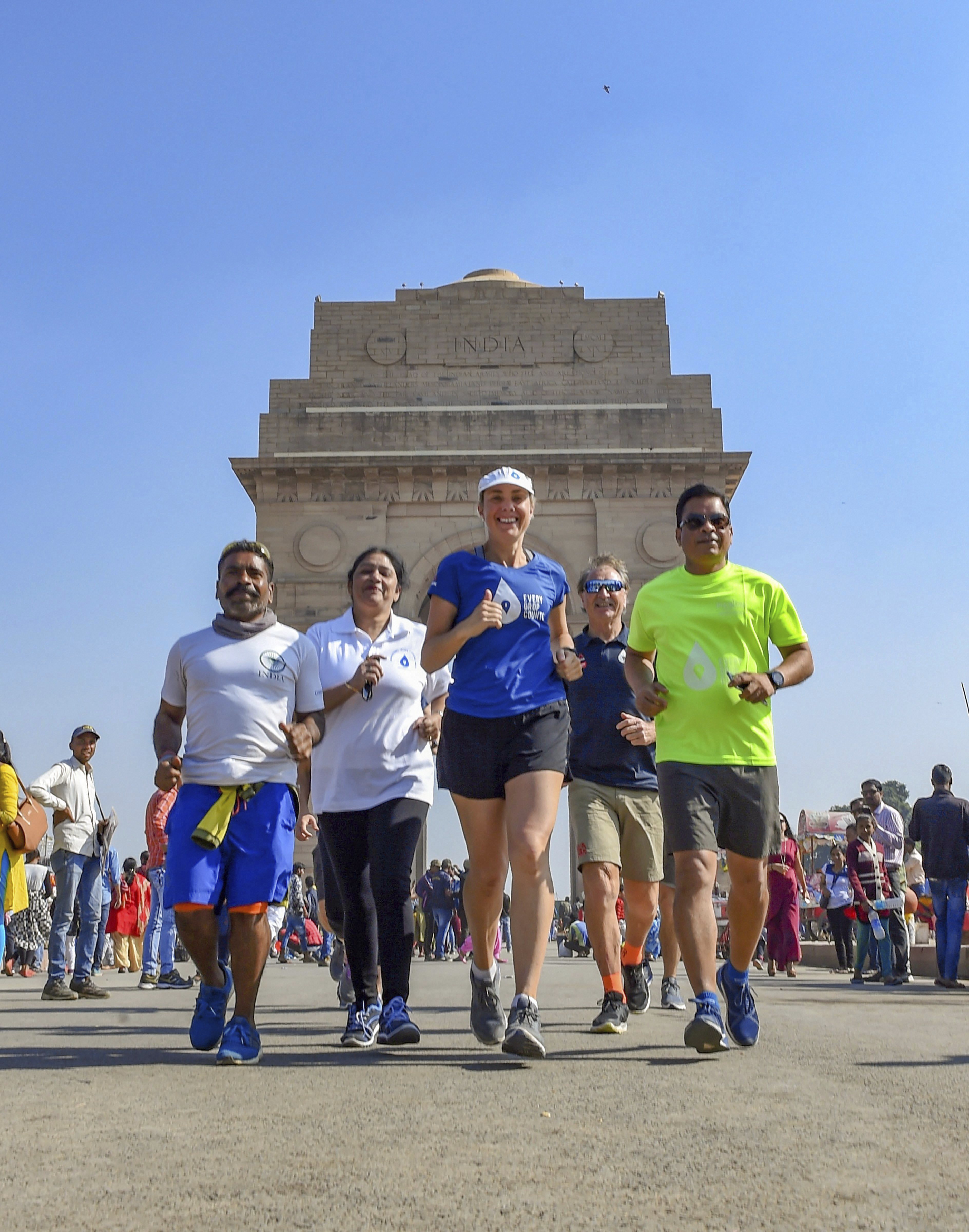 Australian water advocate and Thirst founder and CEO, Mina Guli, runs at India Gate to complete 100 marathons in 100 days to call attention to water conservation, in New Delhi - PTI