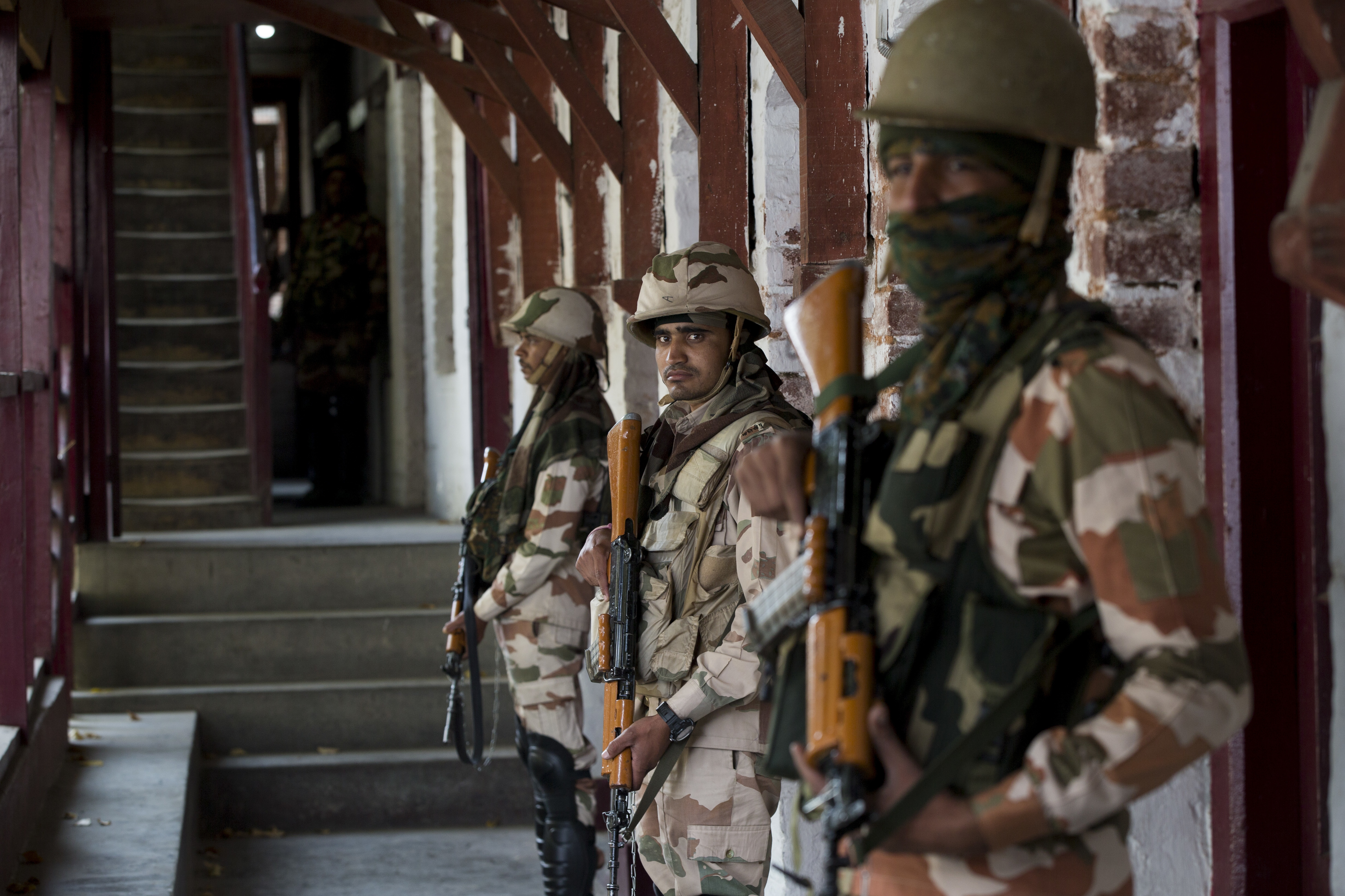 Indian paramilitary soldiers guard a poling station during second phase of local elections in Srinagar - AP