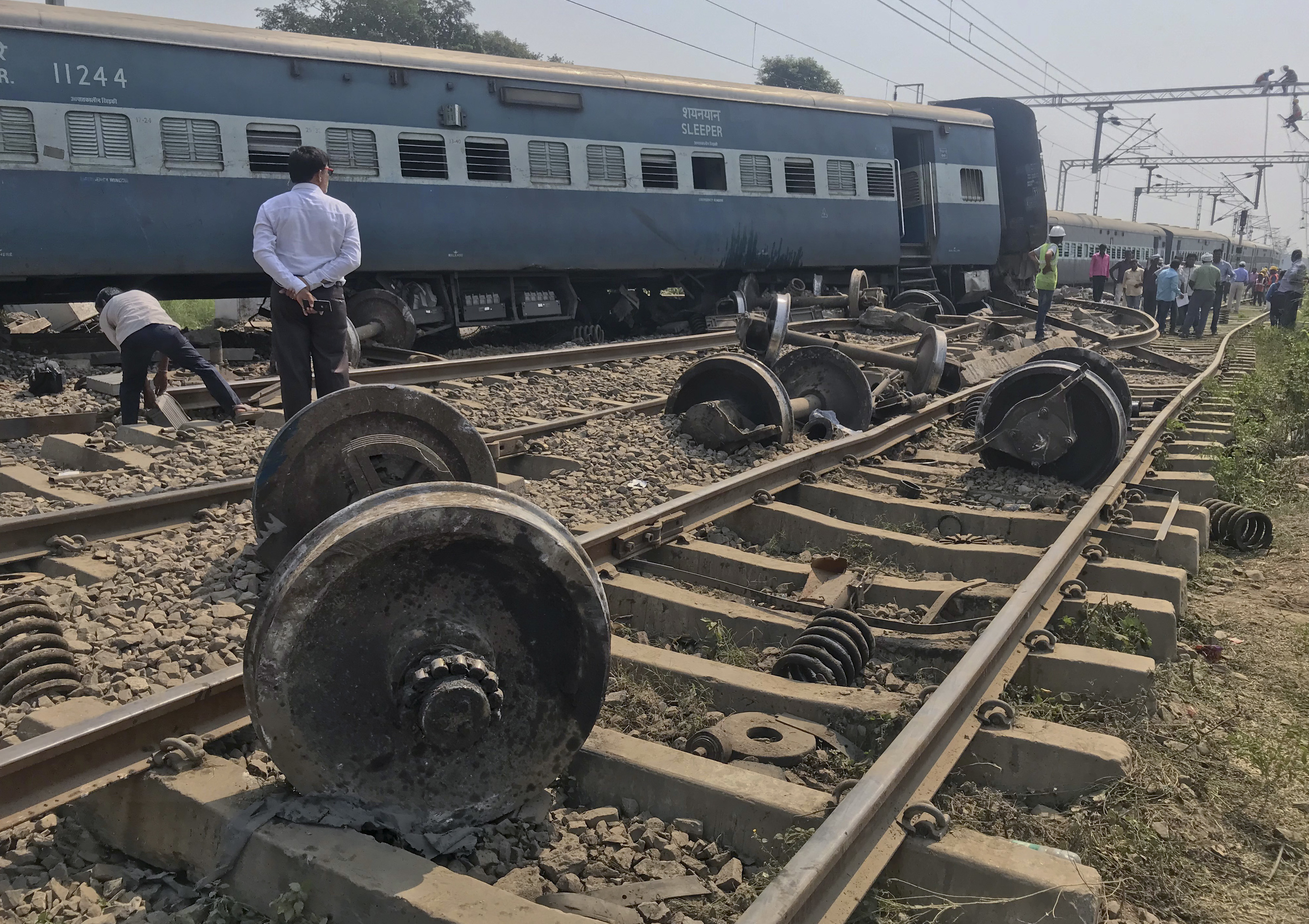 An official stands at the scene after an express train partially derailed at a railway station in Rae Bareli, 80 kilometers southwest of Lucknow, the capital of Uttar Pradesh state, India - PTI