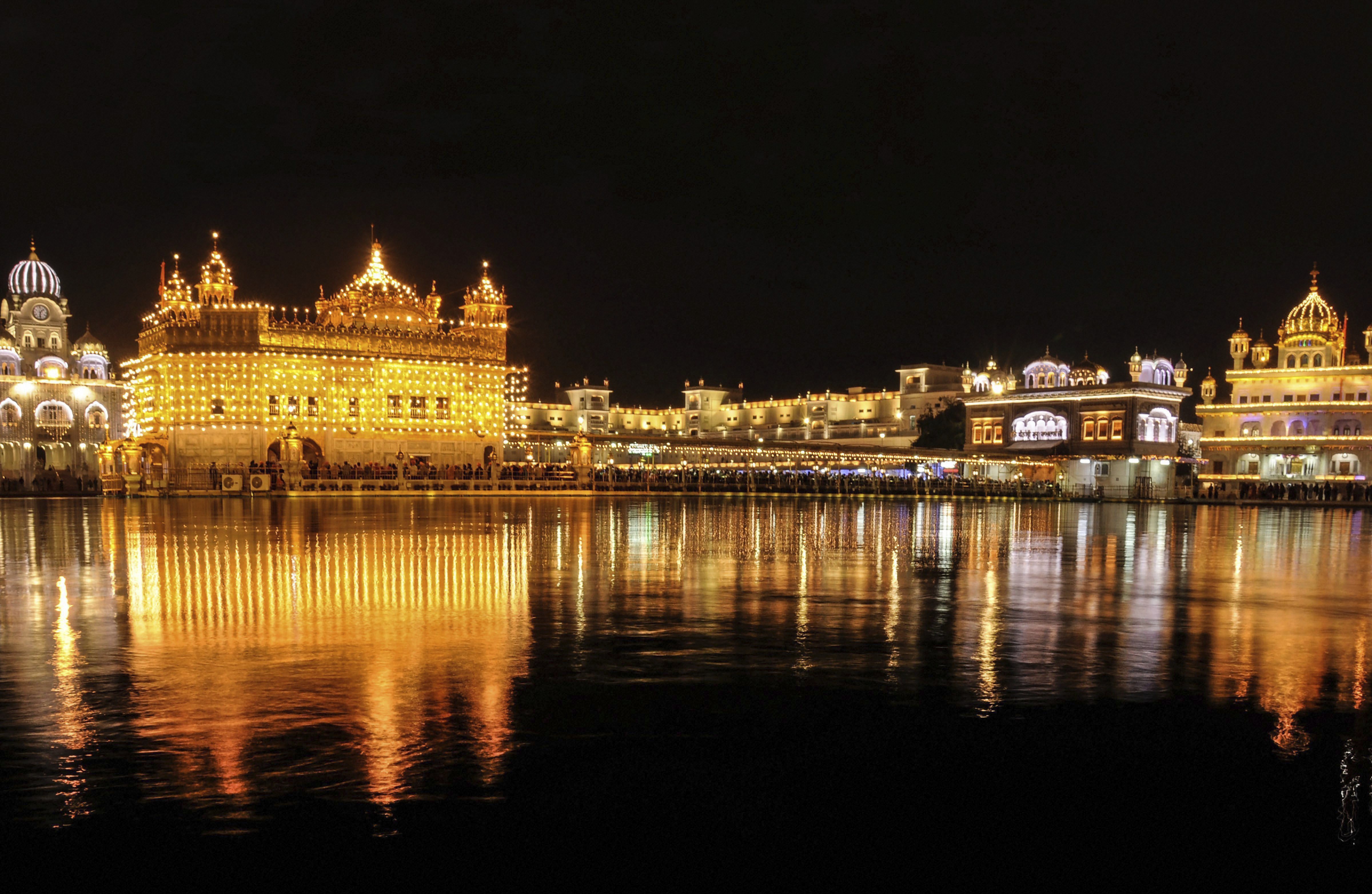 An illuminated view of Sri Harmandir Sahib (Golden Temple) on the eve of 550th birth anniversary of Guru Nanak Dev Ji, in Amritsar - PTI