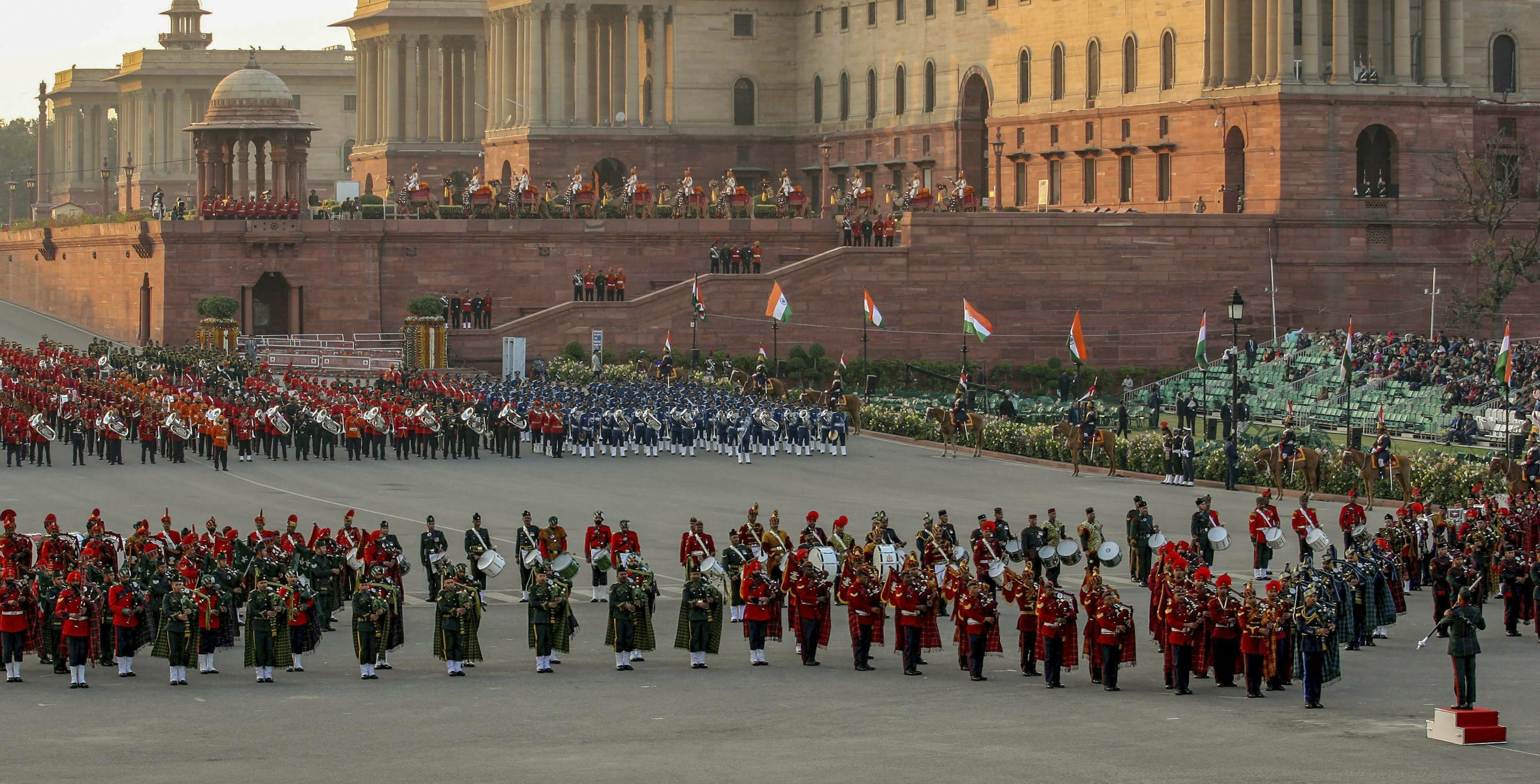 Tri-services bands perform during a rehearsal for the Beating Retreat ceremony at Vijay Chowk, in New Delhi - PTI