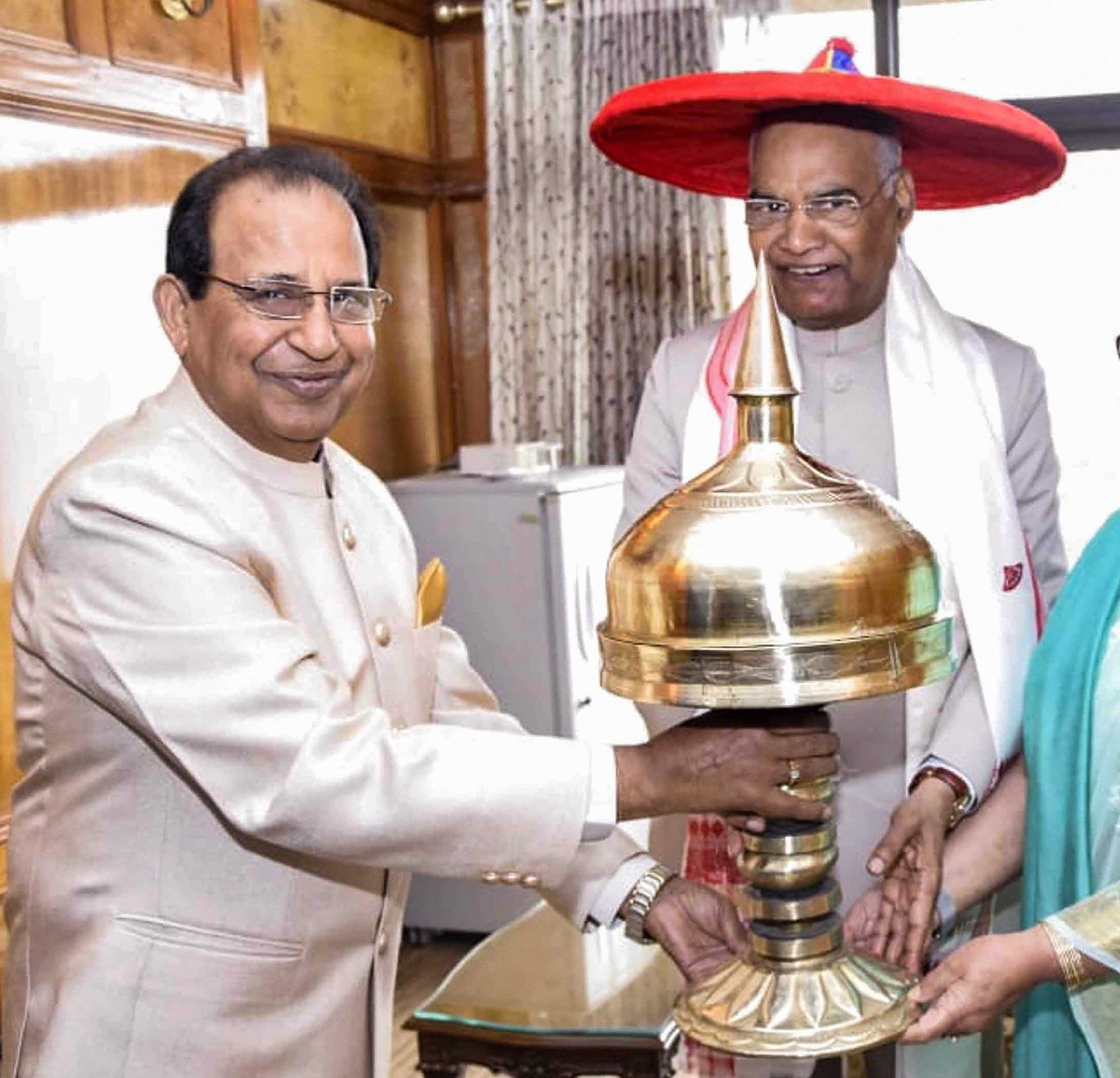 President Ram Nath Kovind being felicitated by Assam governor Jagdish Mukhi with Assamese Japi and Xorai, at Raj Bhavan in Guwahati - PTI