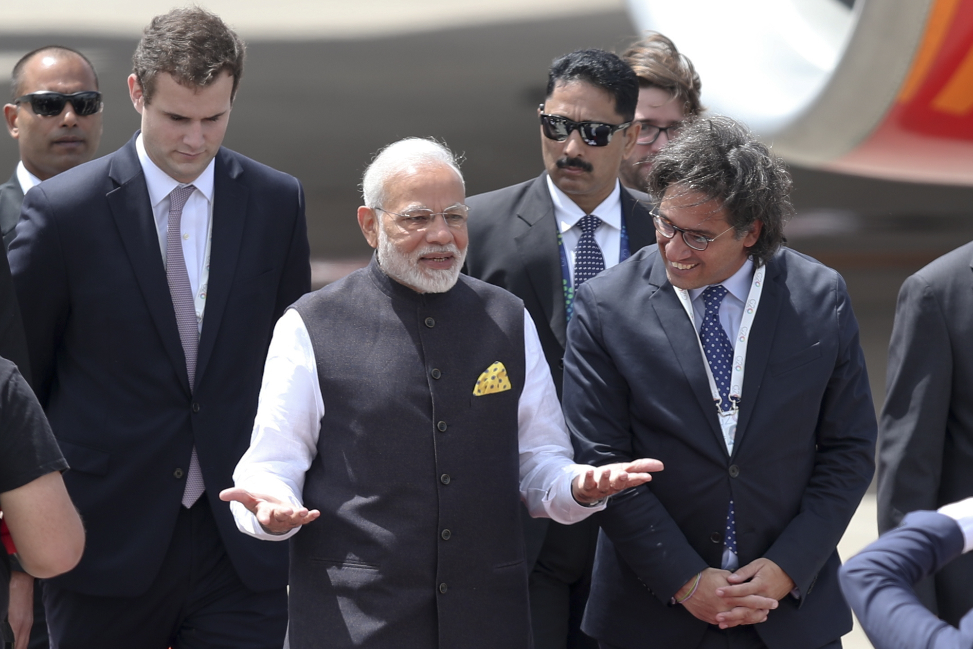 India's Prime Minister Narendra Modi gestures after he was welcomed by Argentina;s Justice Minister German Garavano, right, upon his arrival at the Ministro Pistarini international airport to attend the G20 Summit in Buenos Aires, Argentina - AP