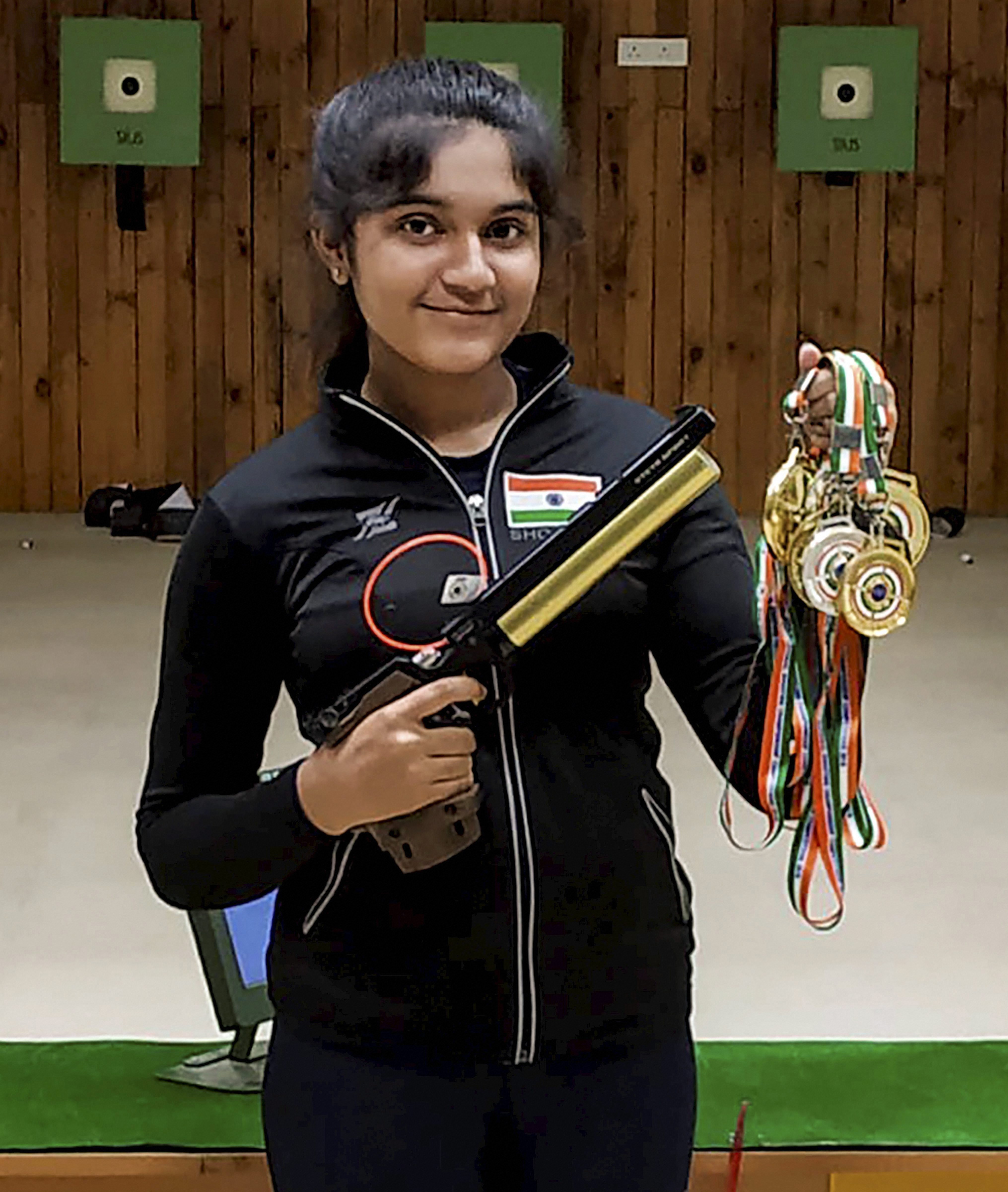 13-year old shooter Esha Singh poses for photograph with her medals that she won at 62ndNational Shooting Championships in Trivandrum, Kerala - PTI