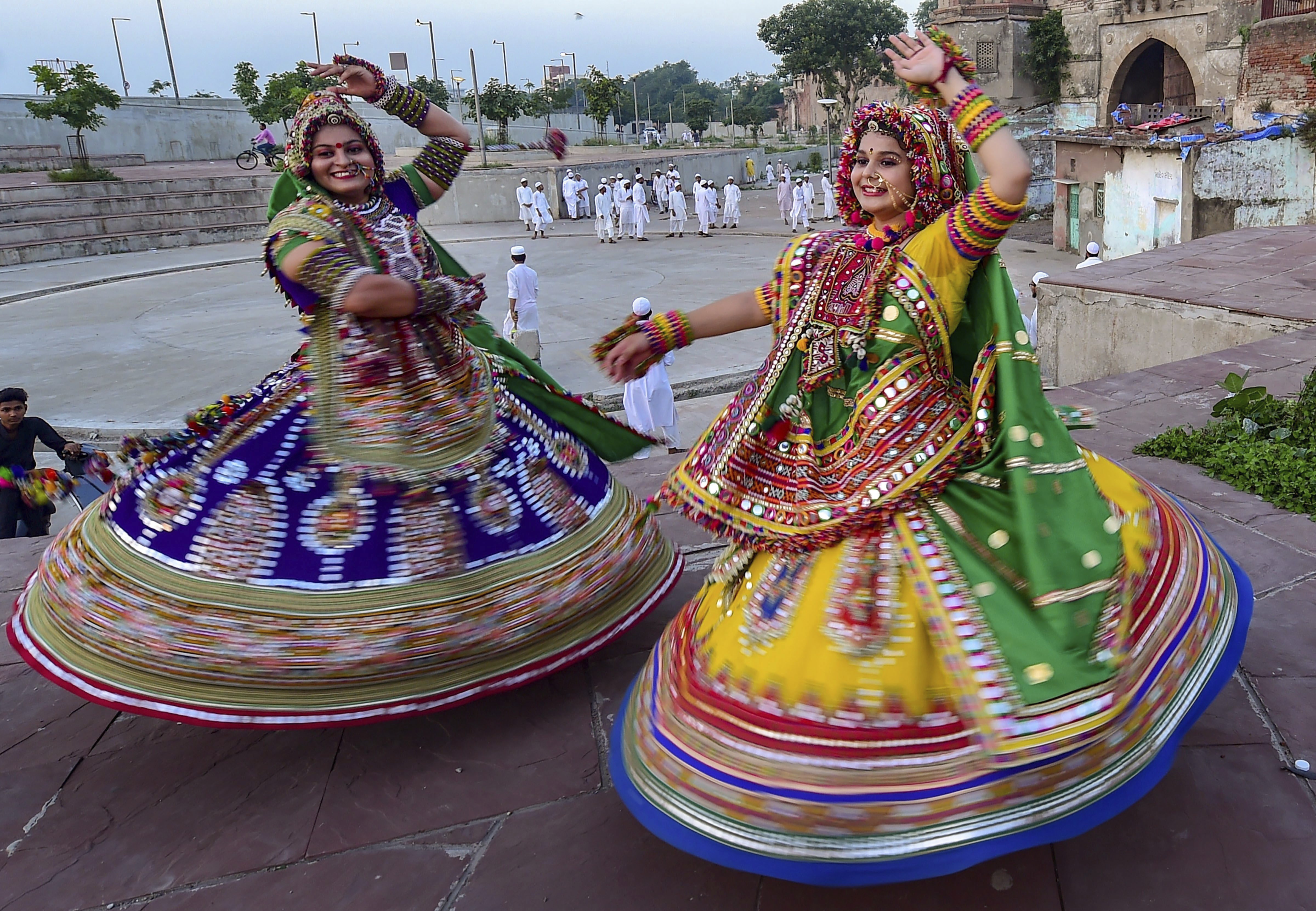 Dancers, dressed in traditional attire, take part in the rehearsals for the 'Garba' dance, ahead of nine-day Navratri festival in Ahmedabad - AP