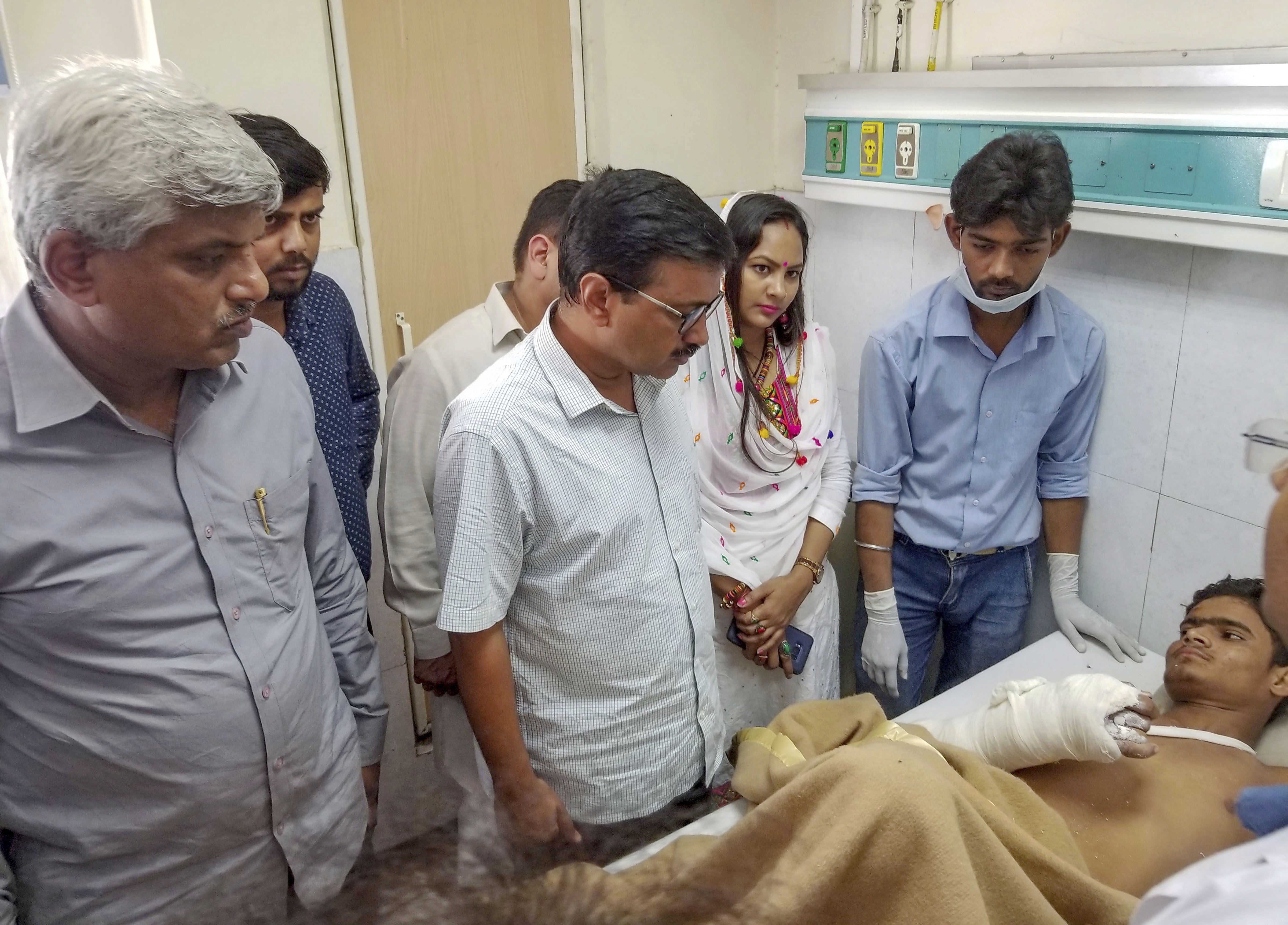 Delhi Chief Minister Arvind Kejriwal visits a victim of a building collapse in Ashok Vihar, at a hospital in New Delhi - PTI