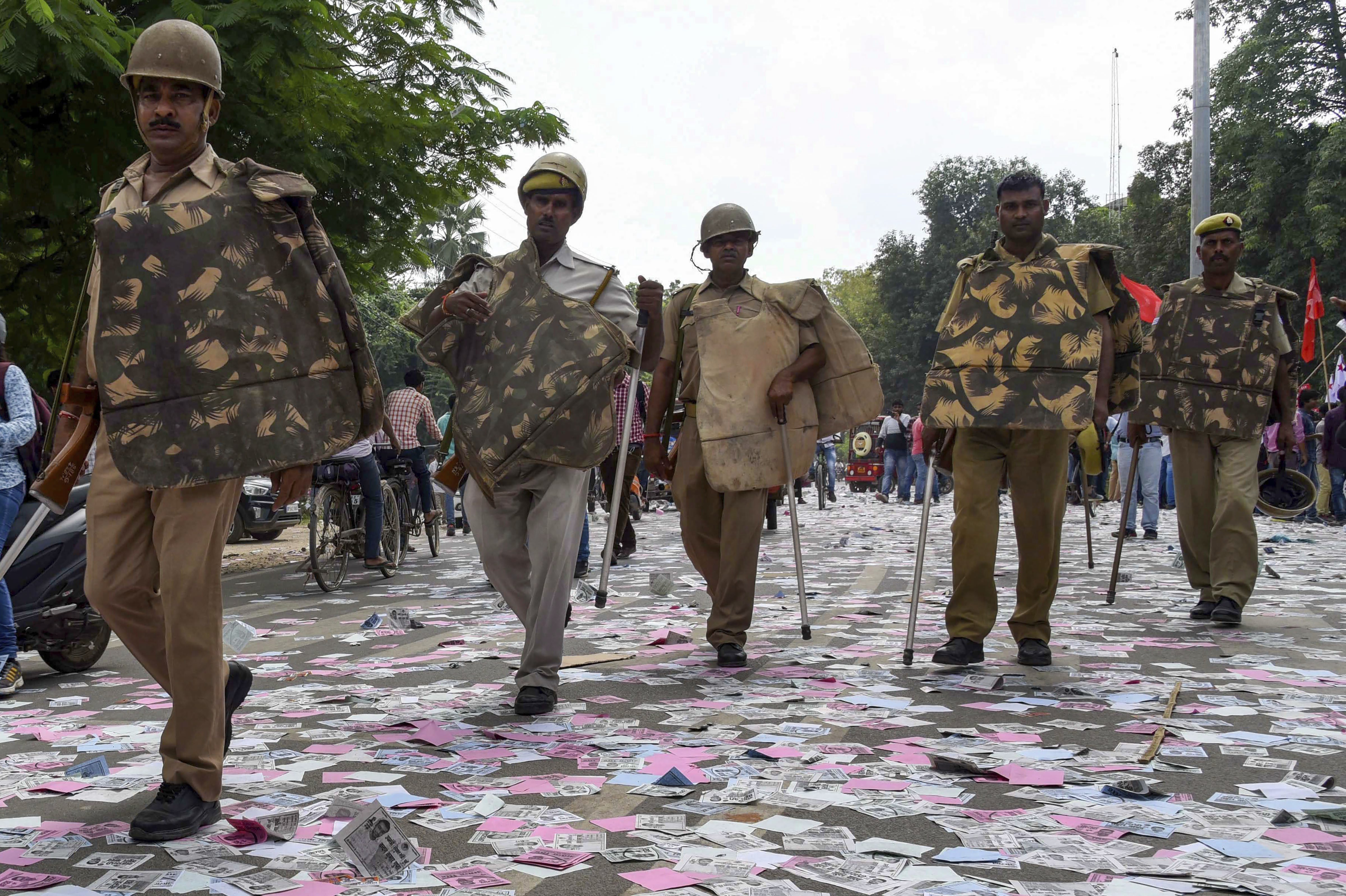 Police arrive to control the situation after a clash between two students' groups during nomination filing for Allahabad University Students elections, in Allahabad - PTI