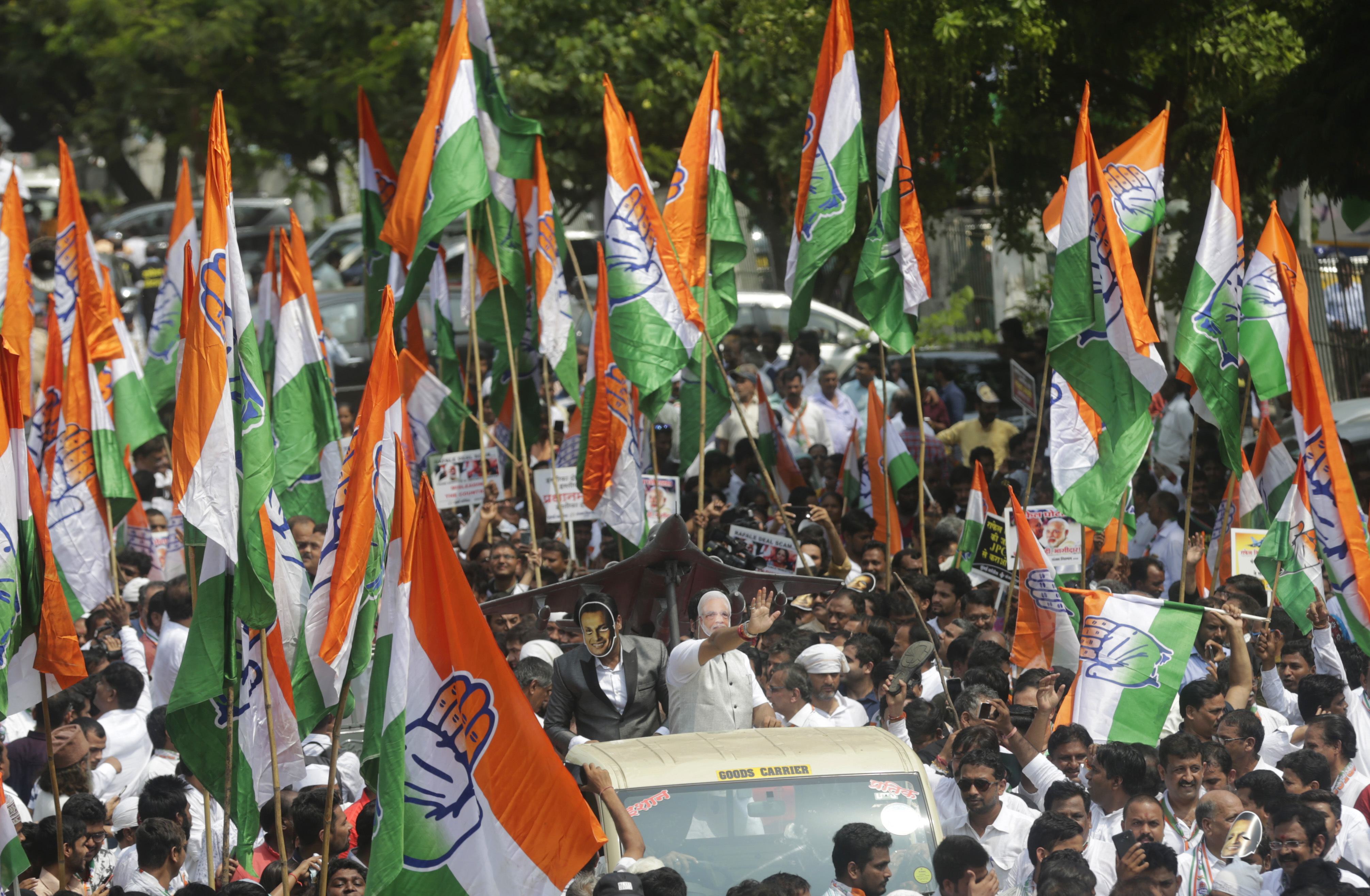 India's opposition Congress party activists shout slogans accusing the Narendra Modi government of buying 36 Rafael fighter aircraft from France at a highly inflated price during a protest in Mumbai - AP