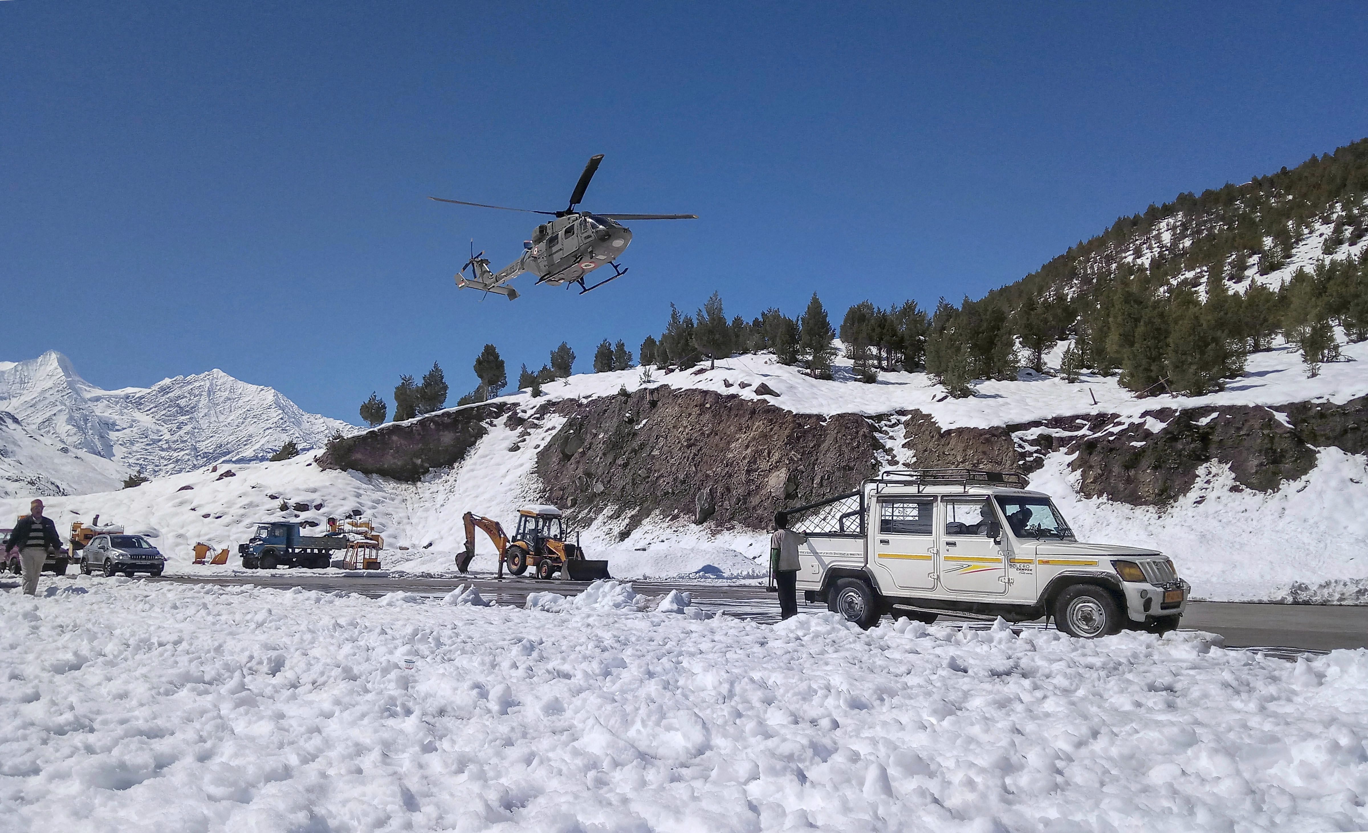 Indian Air Force (IAF) carry out rescue operations at a remote shelter as incessant rains continue to disrupt daily lives, near Chhota Dara - PTI