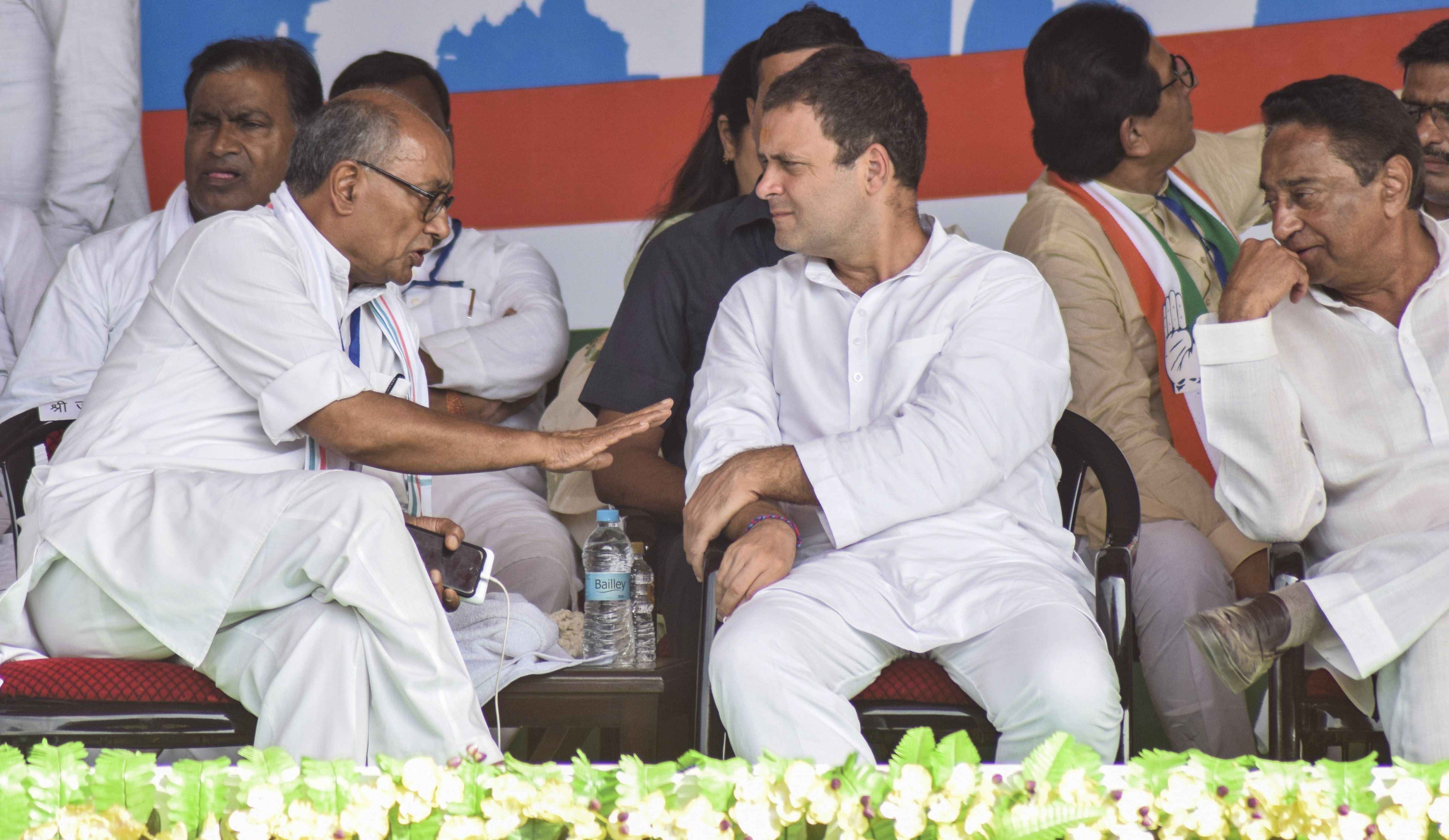 Congress President Rahul Gandhi (L) with senior leader Digvijay Singh and MPCC President Kamal Nath during a public meeting in Satna - PTI