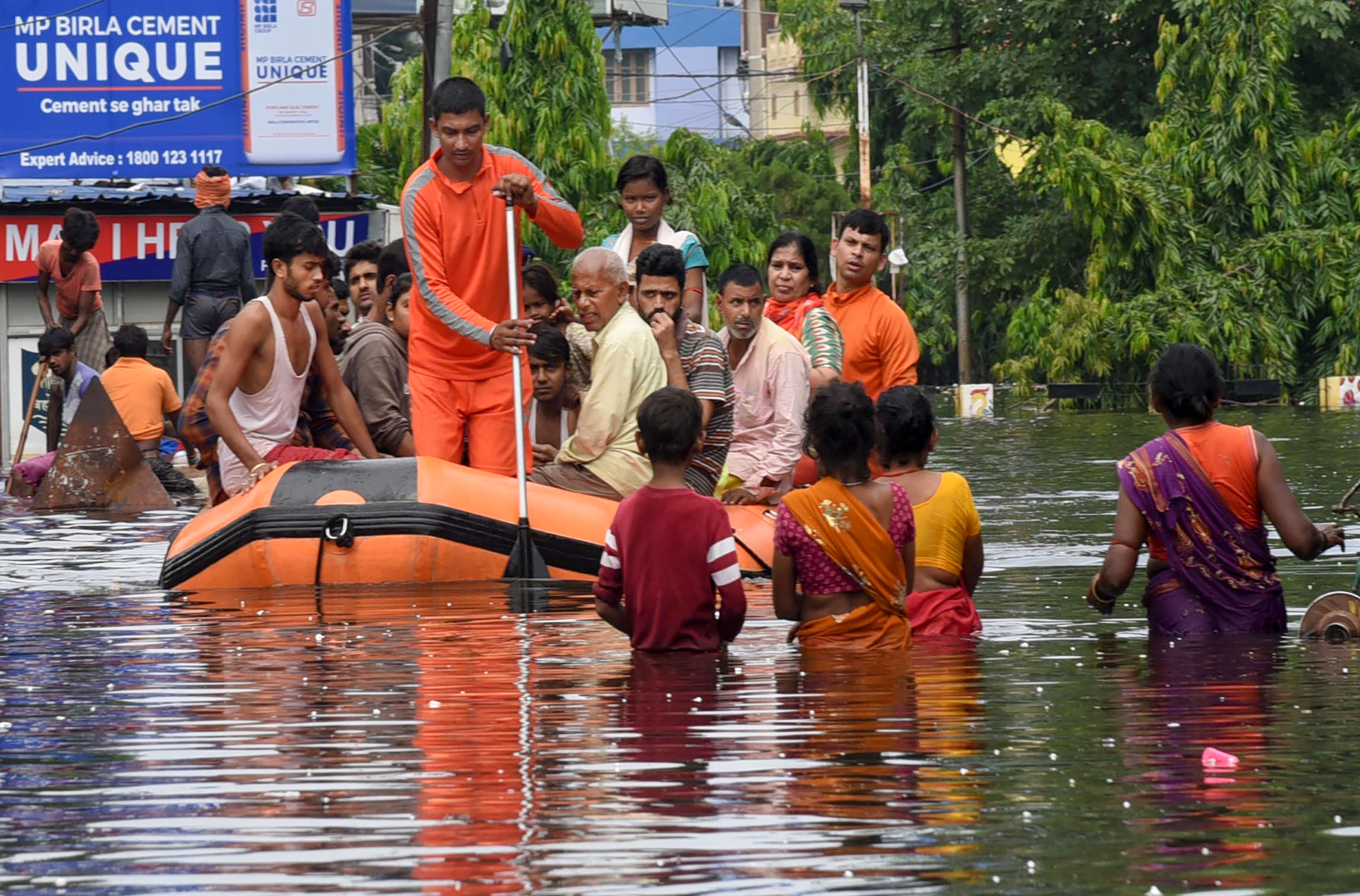 Disaster Response Force (NDRF) workers rescue people from flood-affected  Bahadurpur area after heavy rains, in Patna - PTI