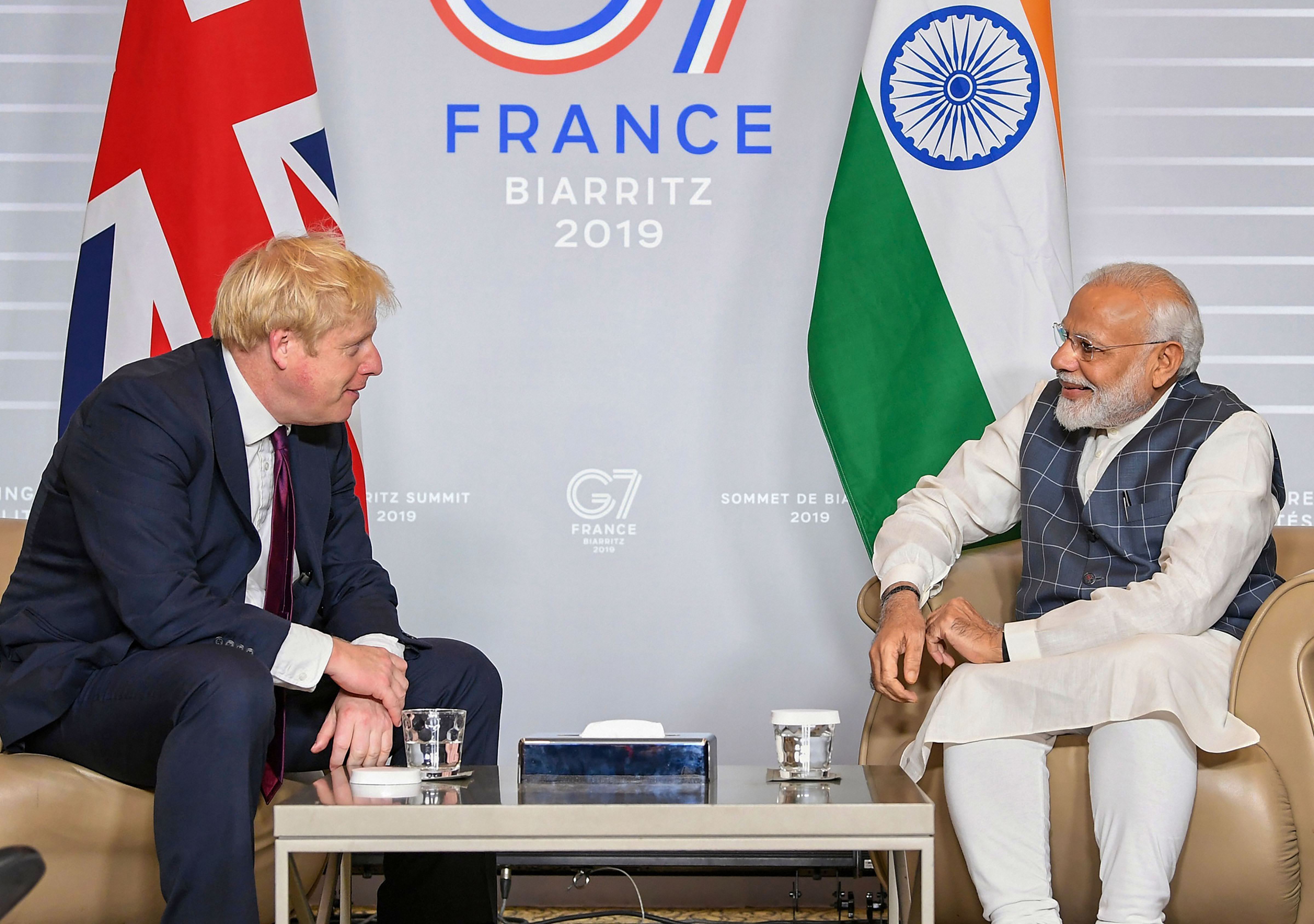 Prime Minister Narendra Modi meets British Prime Minister Boris Johnson during the G7 Summit, in Biarritz, France - PTI