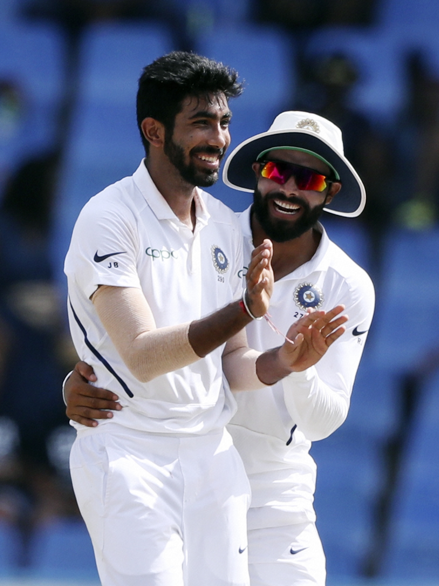 India's Jasprit Bumrah celebrates with KL Rahul after taking the wicket of West Indies' Shai Hope during day four of the first Test cricket match at the Sir Vivian Richards cricket ground in North Sound, Antigua and Barbuda - PTI