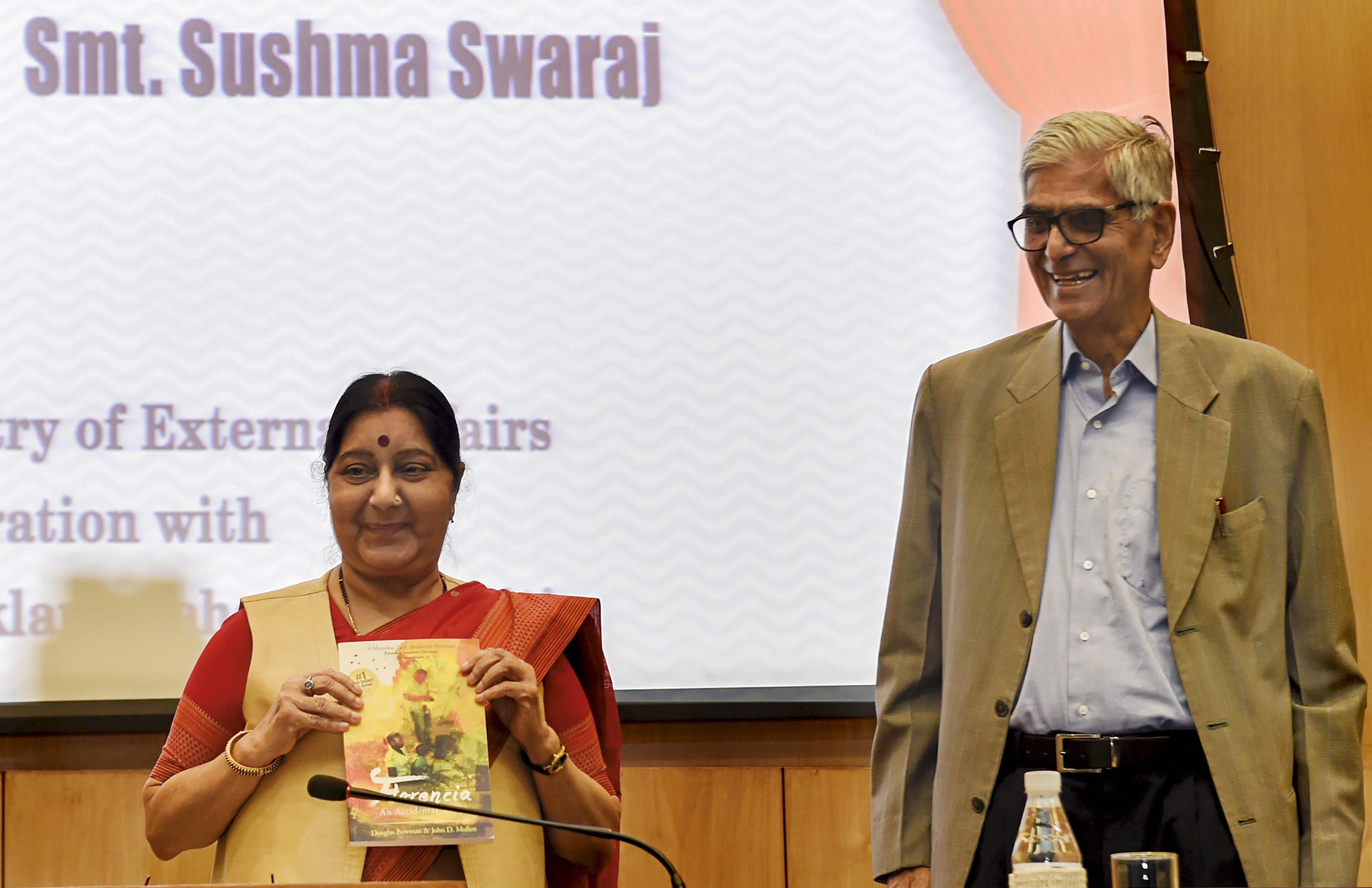 nion External Affairs Minister Sushma Swaraj releases a publication as Jaipur Foot Organisation founder D. R. Mehta looks on, at the launch of 'India For Humanity